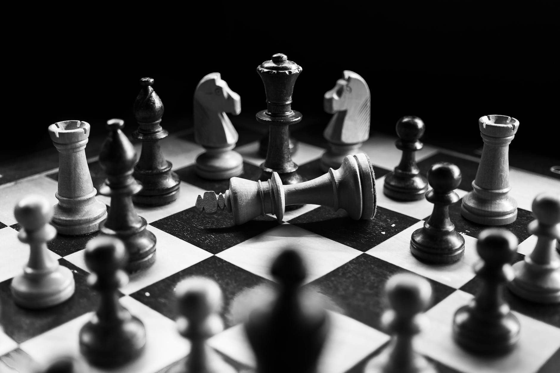 grayscale photography of chessboard game